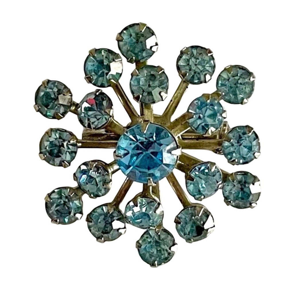 Vintage Silver Tone Starburst Brooch With Pale Blue Rhinestones